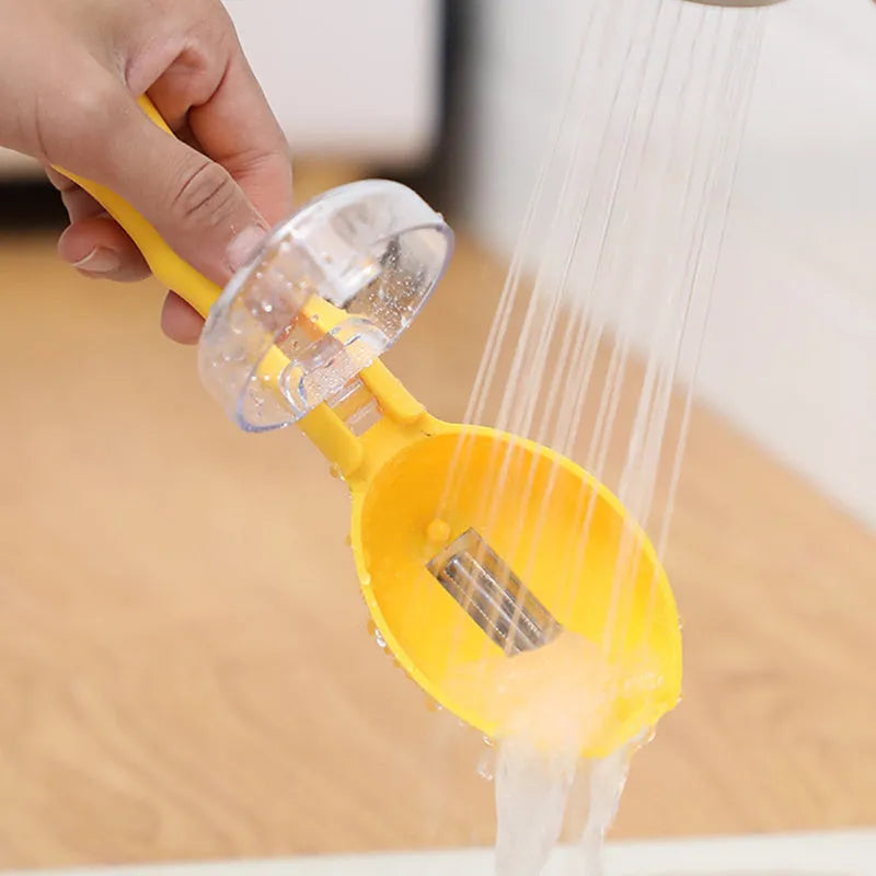 Yellow peeling knife with a stainless steel blade and a matching plastic storage lid on a kitchen worktop.