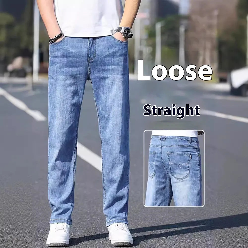 Men's thin stretch tapered denim trousers in light blue colour on a business casual model