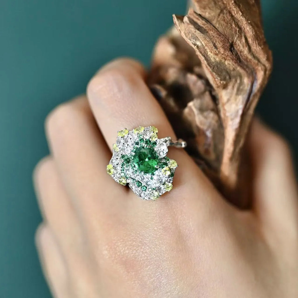Secret Garden Series gradient emerald ring on a plain background showing the stone colour