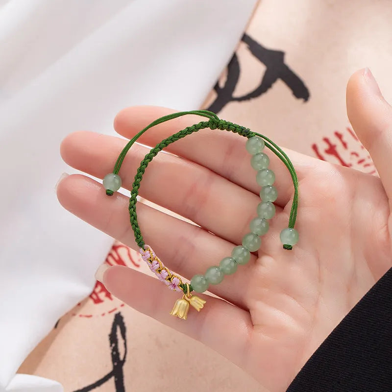 Lily hand woven red rope bracelet with flower elements and national style design