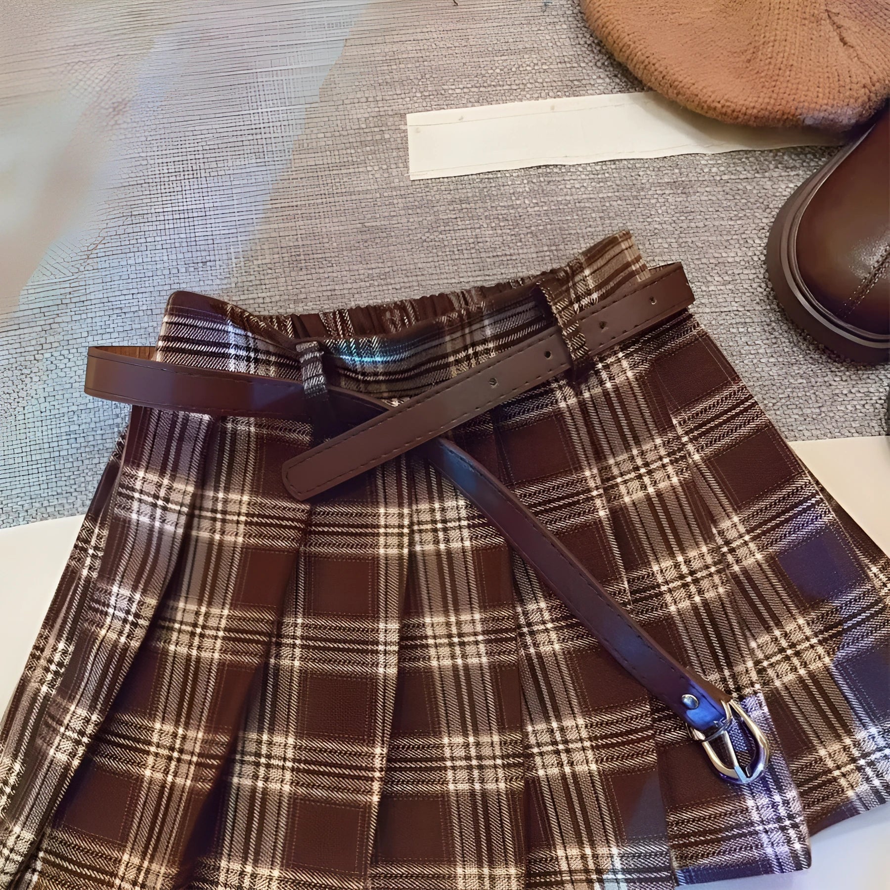Children's cotton plaid pleated skirt with A-line silhouette shown on mannequin