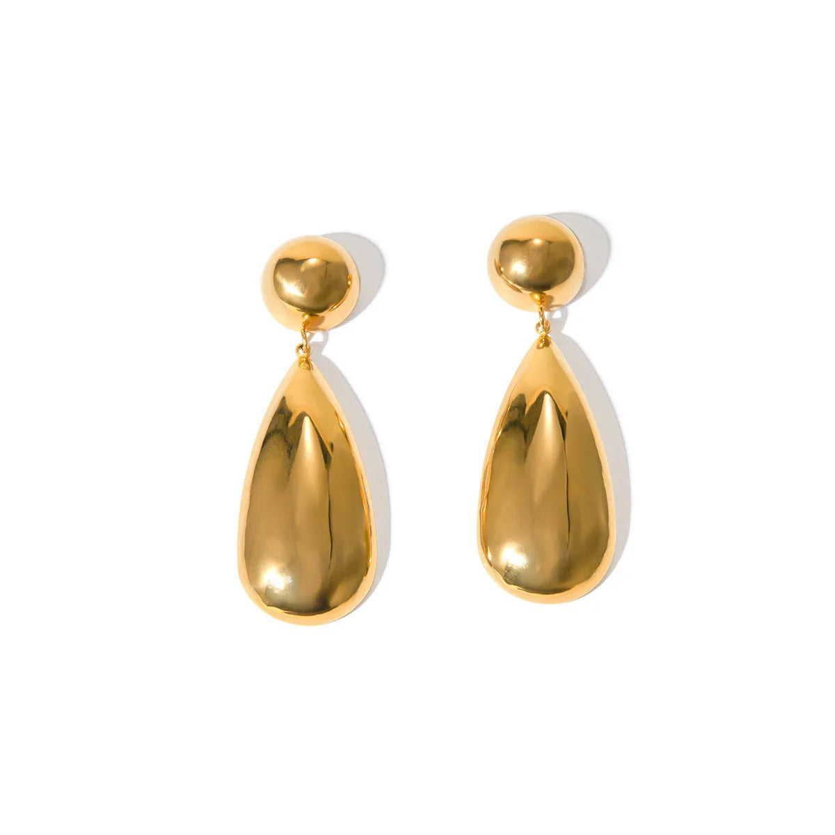 A pair of gold-coloured stainless steel earrings with a geometric water drop and hemisphere pendant design.