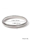 Women's titanium steel bracelet with vertical stripe pattern in gold or silver, available in 0.8cm to 2.0cm widths
