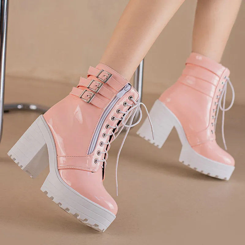 Women's black thick-heeled ankle boots with lace-up front and round toe on a waterproof platform
