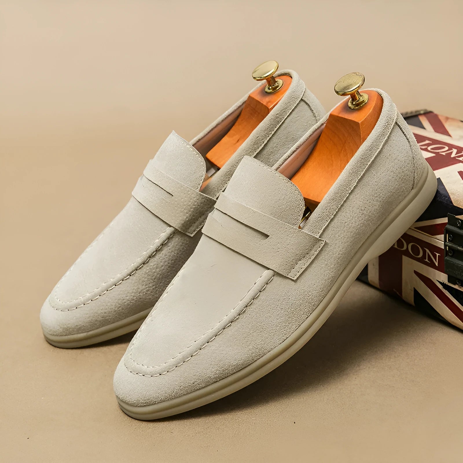 Men's black slip-on leather casual shoes with round toe and mid heel on a rubber sole.