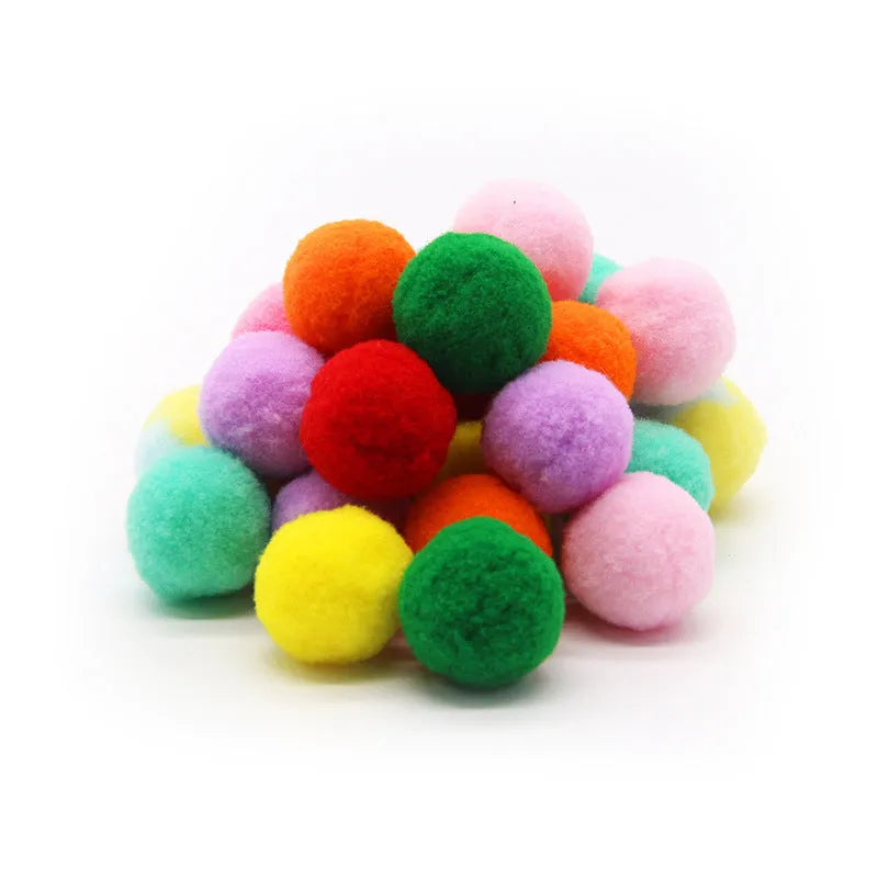 A 30cm long plush ball launcher gun for pets with a selection of soft 3cm yarn balls.