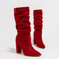 Women's black suede pointed-toe boots with a chunky high heel and mid-calf length