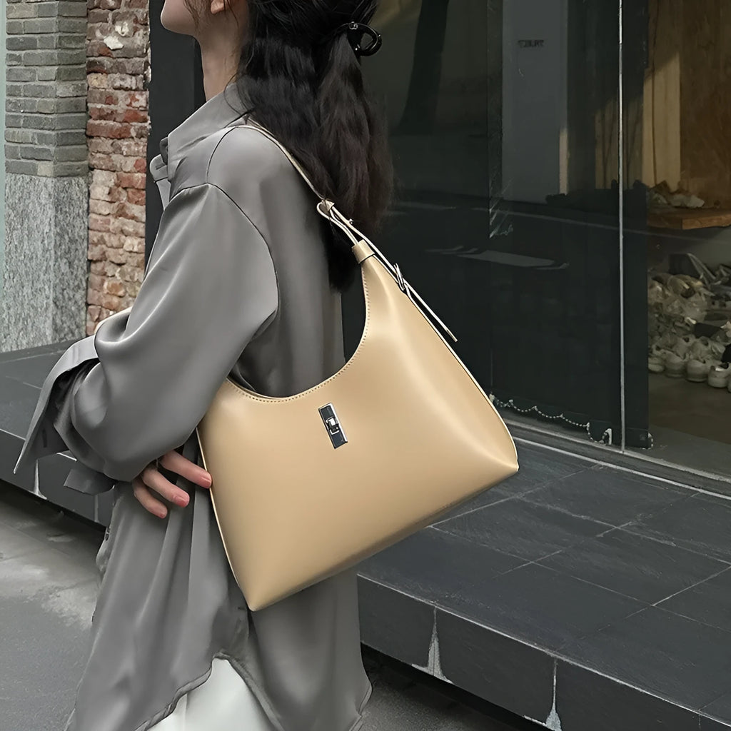 Women's apricot genuine leather crossbody bag showing dumpling shape and sandwich pocket design