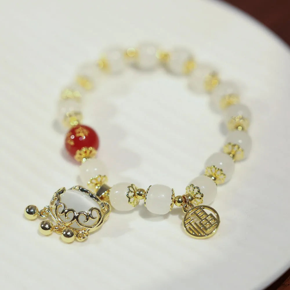 Women's Chinese style glass bracelet with Fu character and safety lock design in coloured glaze