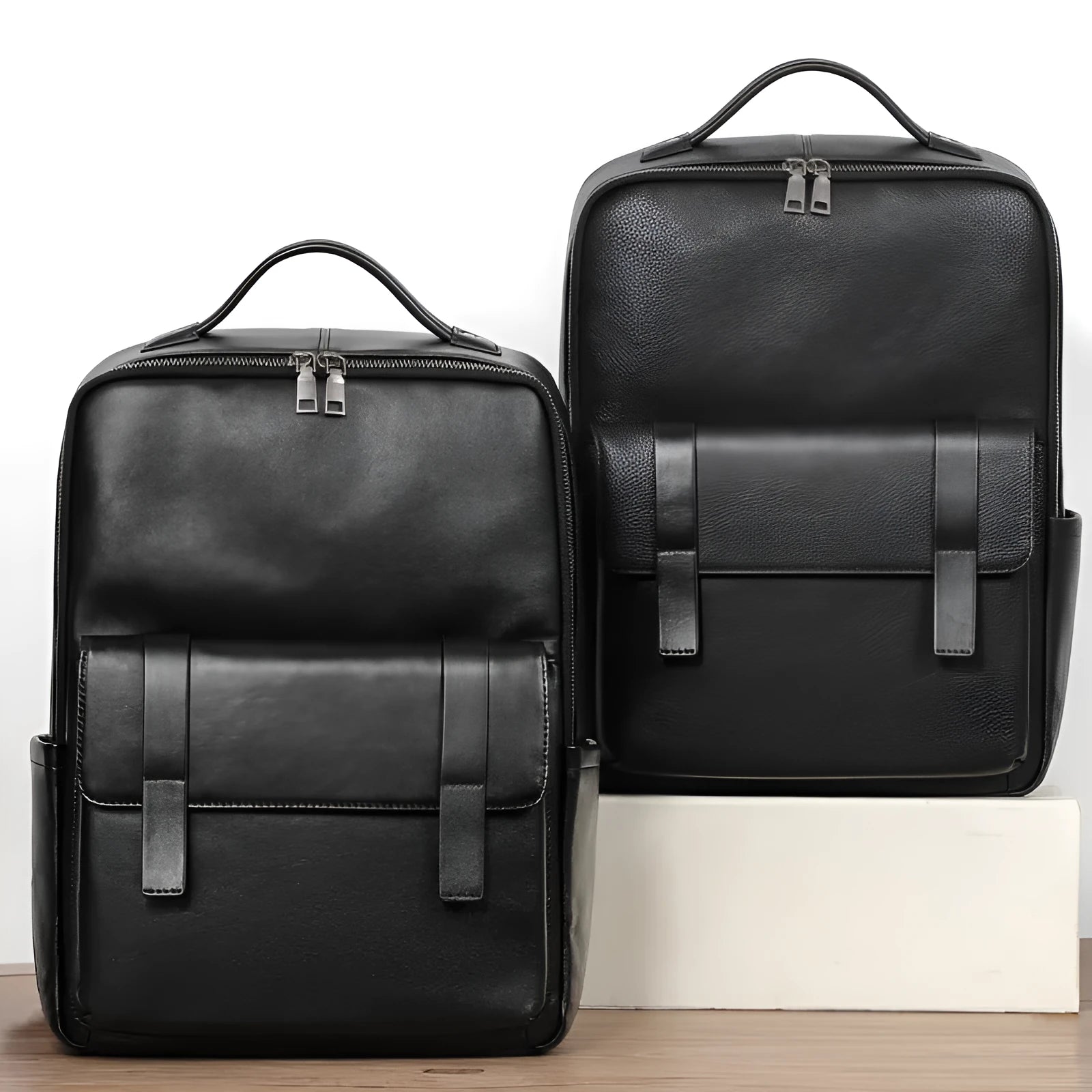 Black genuine leather men's laptop backpack with woven details and adjustable straps.