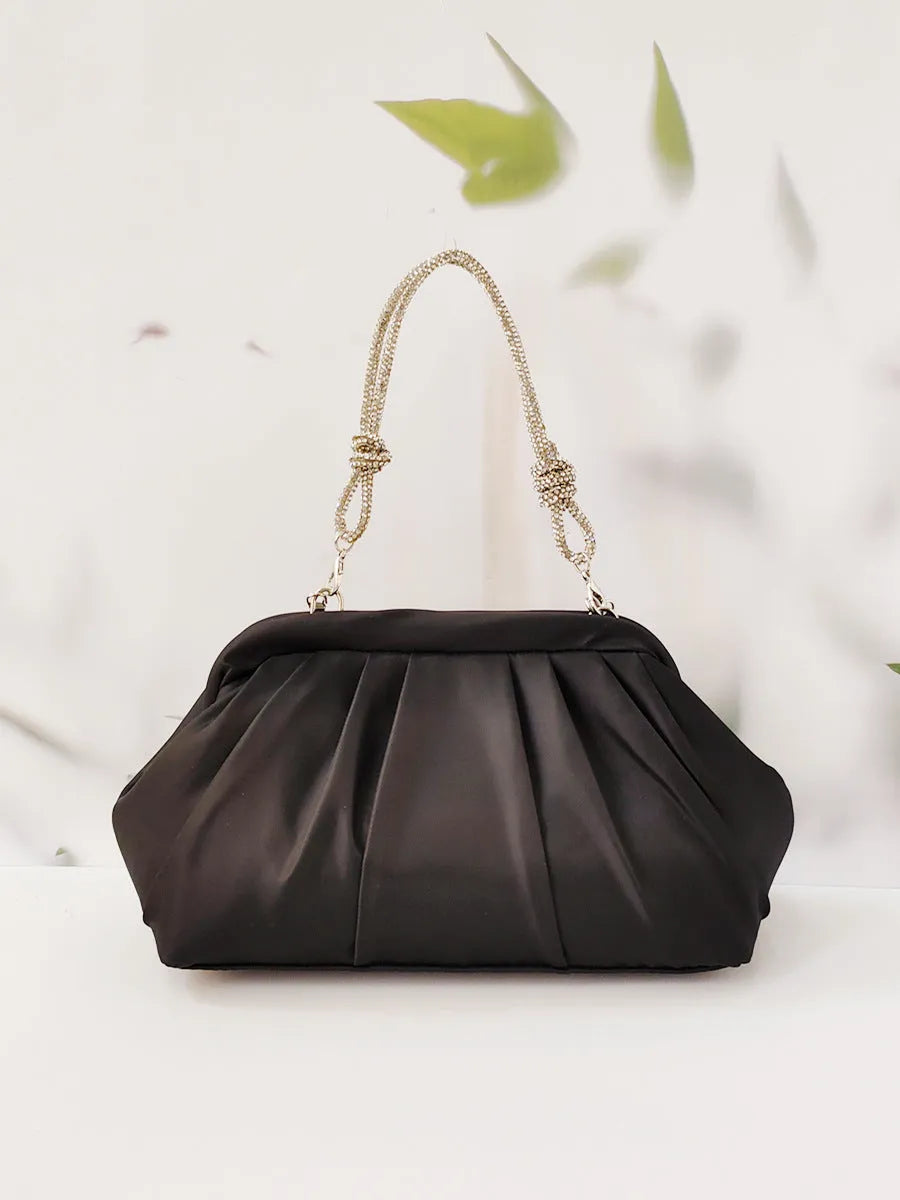 Soft black polyester women's shoulder messenger bag showing chain detail and fold styling.