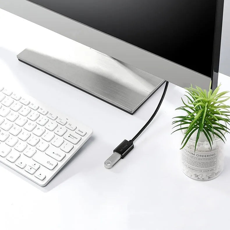 Black USB extension cable with male and female connectors, shown coiled to demonstrate its available lengths.