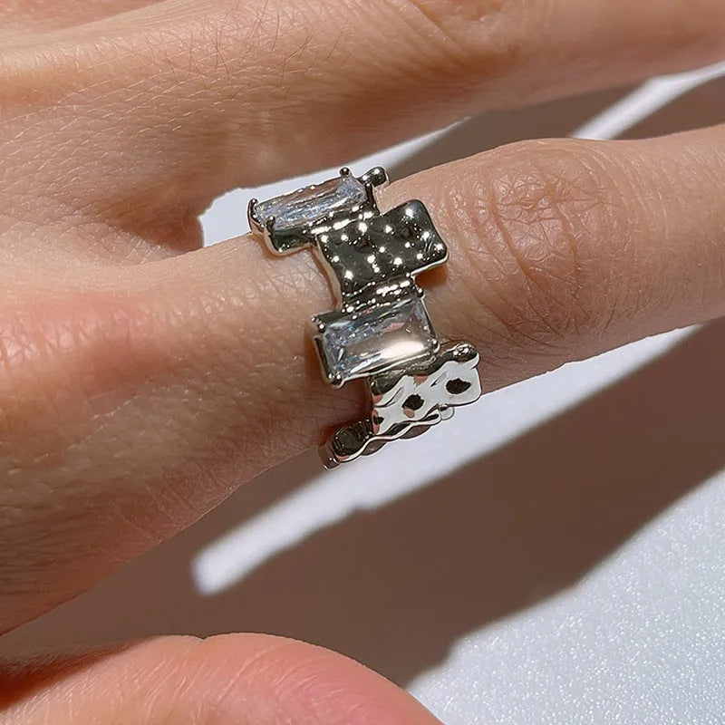 Silver geometric open ring with zircon stone setting and three-dimensional decoration