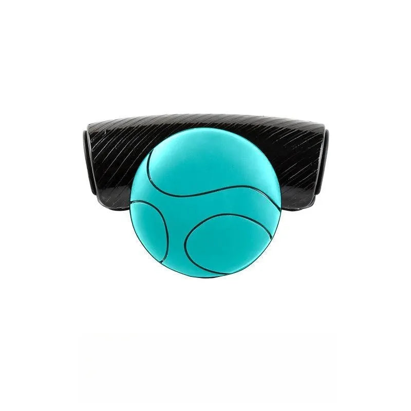 Black silicone steering wheel assist ball with metal bearing for single-handed driving aid.