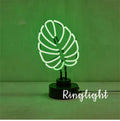 Handmade white bamboo-shaped desk lamp emitting green light, shown in two size options.