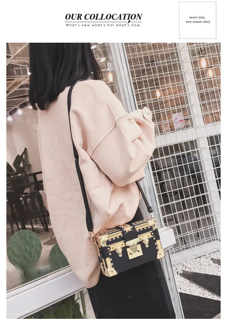 Hard black PU leather women's crossbody flap bag with metal rivet detail and hasp closure.