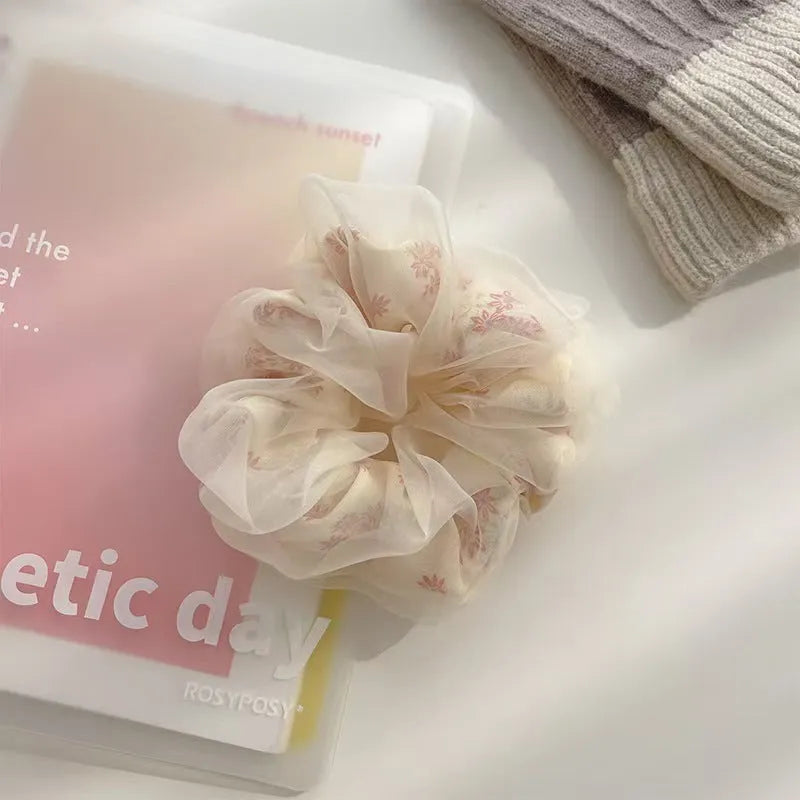 Mesh Sense bun large intestine hair band in milky white, made from soft cloth with a natural style, for women