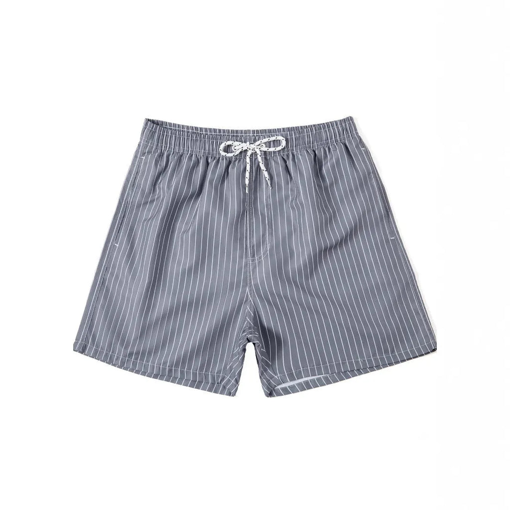 Men's navy blue and grey striped beach shorts with straight legs and built-in lining, laid flat.