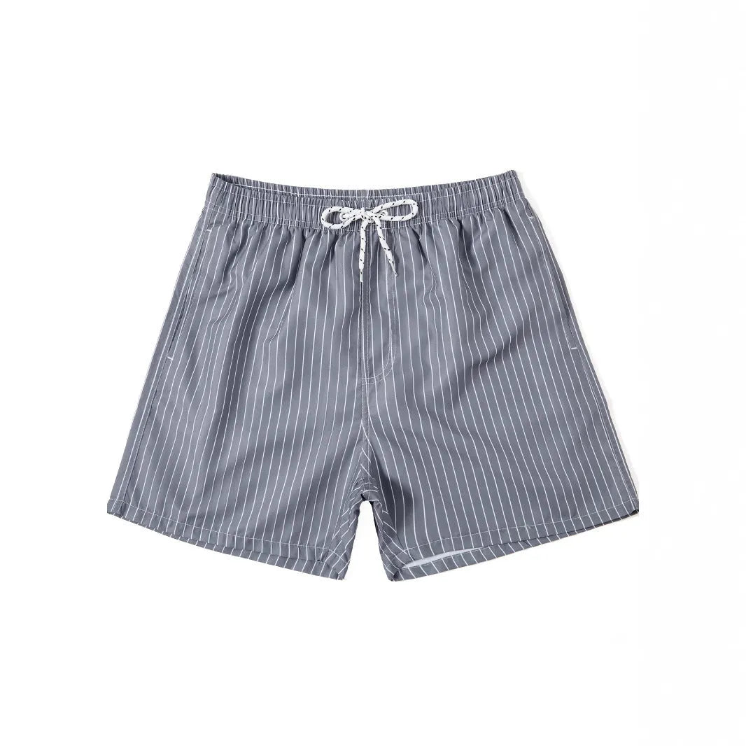 Men's navy blue and grey striped beach shorts with straight legs and built-in lining, laid flat.