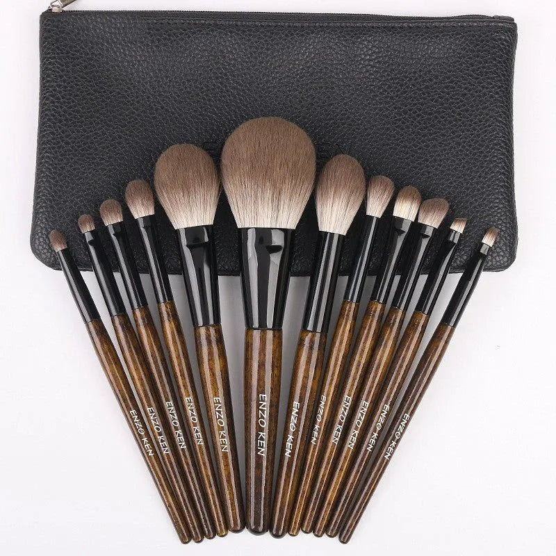 12-piece makeup brush set with wooden handles in a black PU travel case