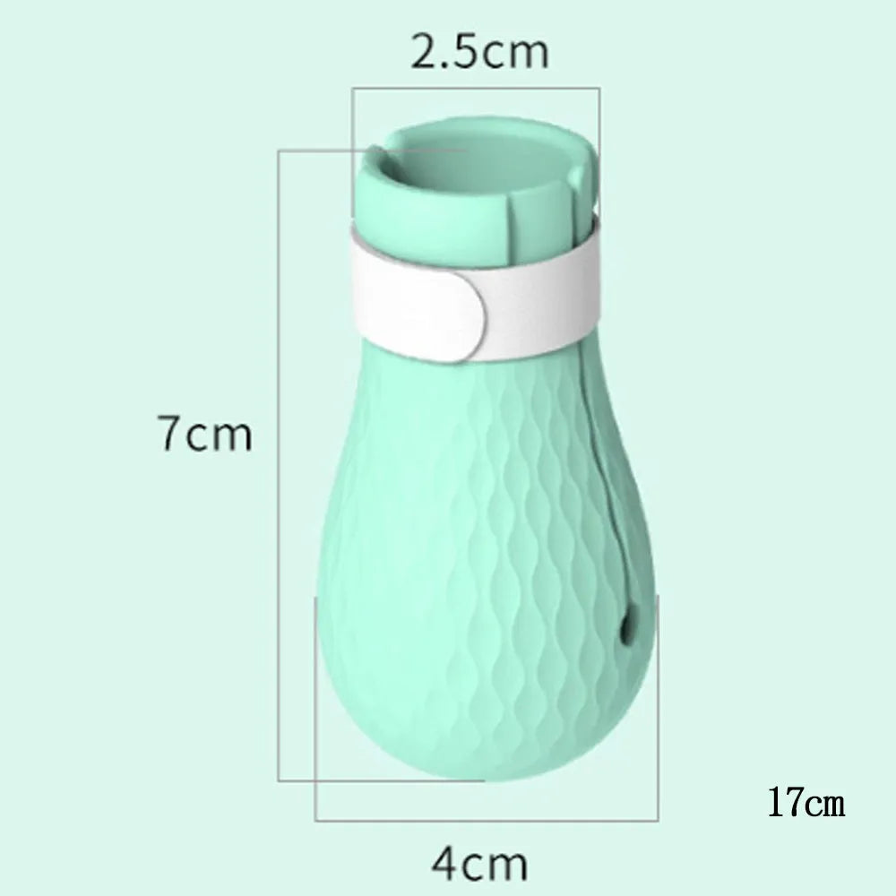 Four green silicone cat anti-scratch foot covers for pet handling protection