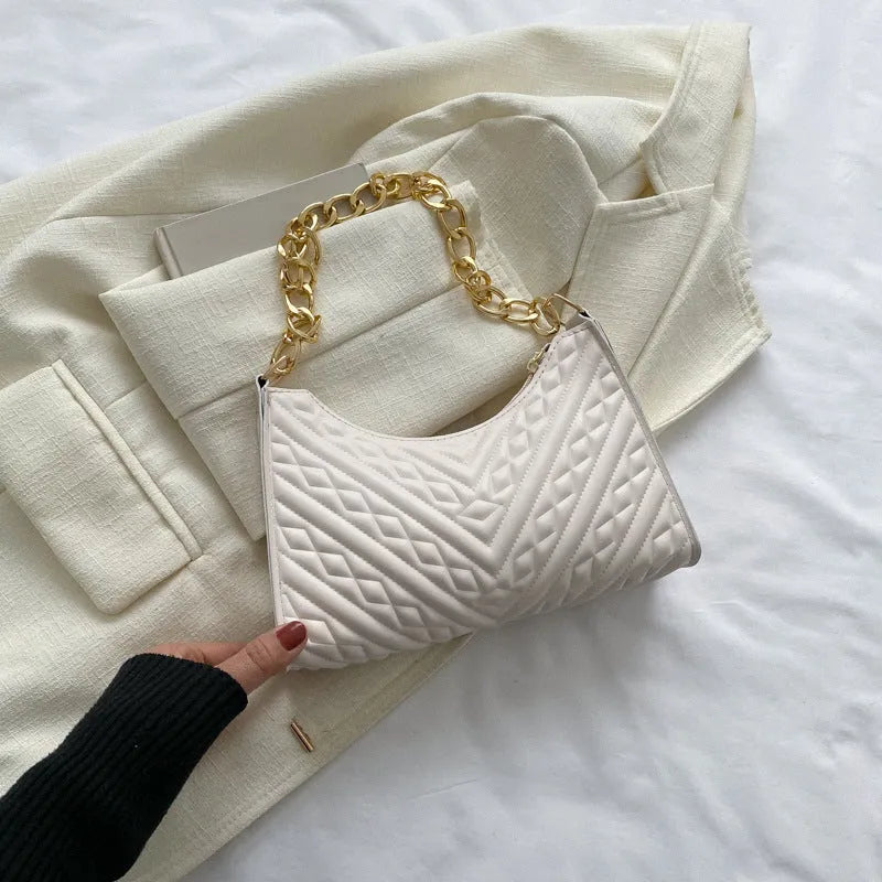 Vertical brown PU leather women's shoulder bag with a pleated front, chain strap, and soft handle.