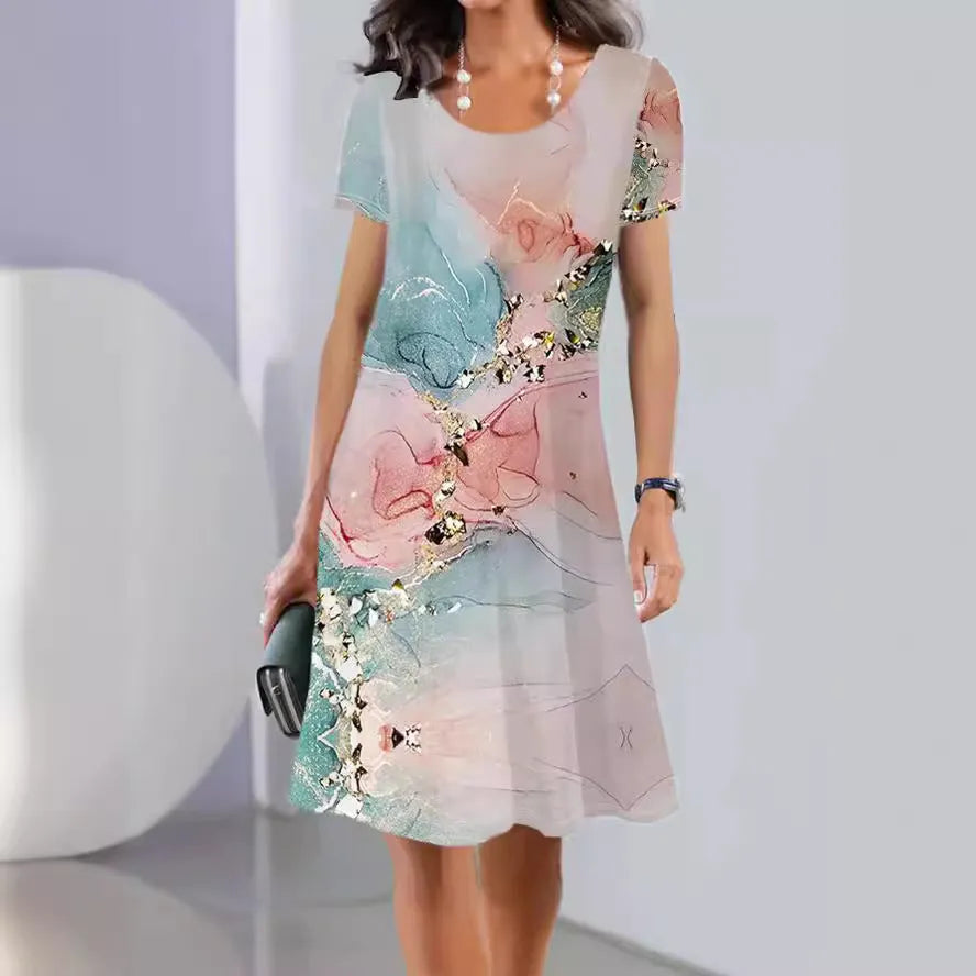 Women's mid-length summer dress with a floral print on light fabric, showing short sleeves and an A-line skirt.