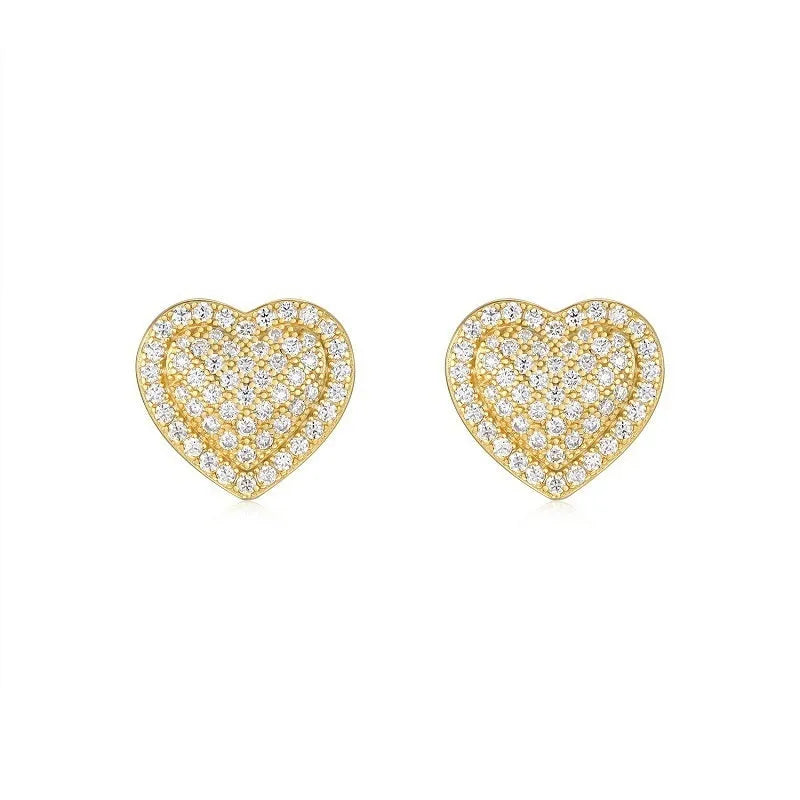 Golden heart-shaped stud earrings with moissanite stones on silver posts