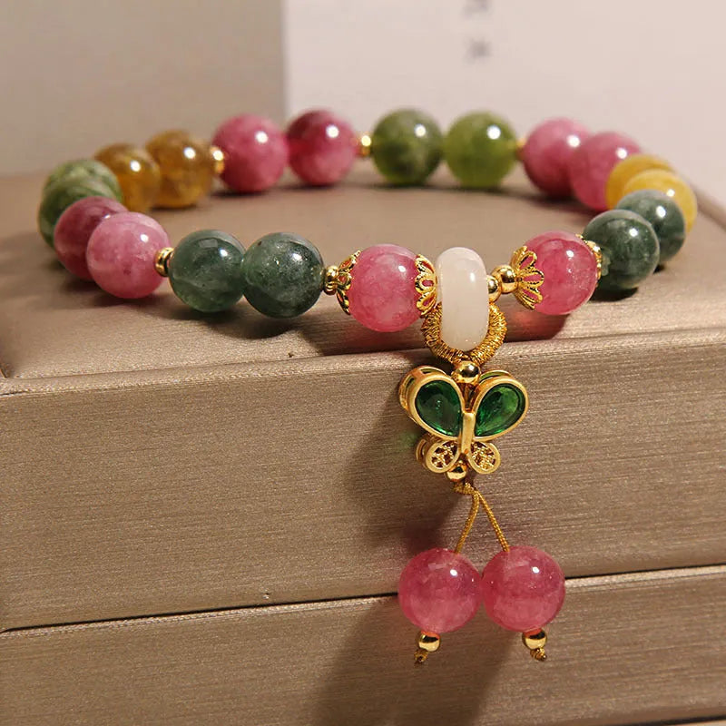 Tourmaline butterfly pendant bracelet with natural jade colour accents and rhinestone details on adjustable alloy chain