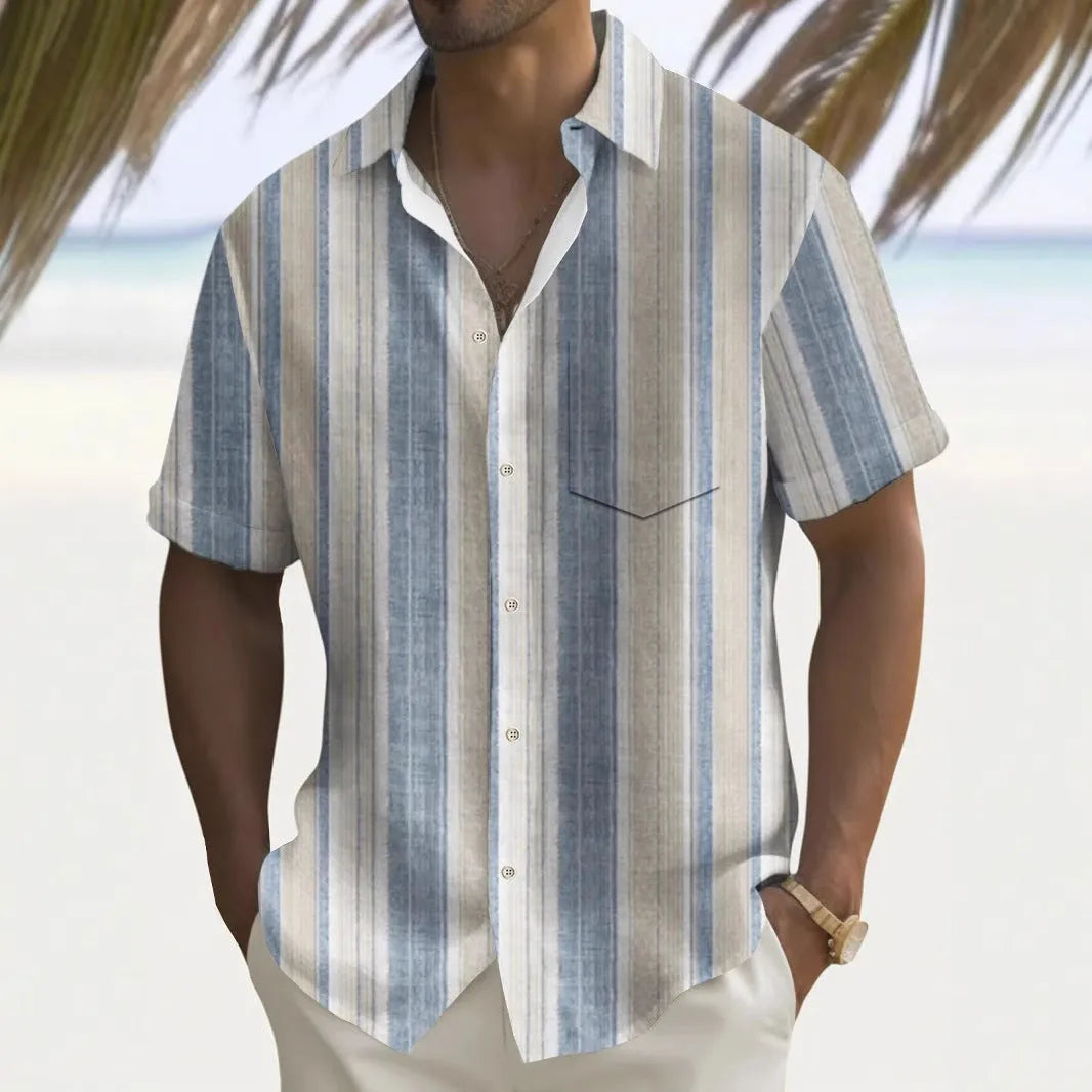 Man wearing a loose, printed polyester cardigan-style shirt in a casual setting.