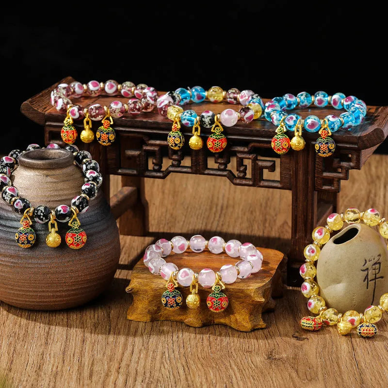 Handmade heart-shaped glass bracelet with swallowing gold beast pattern in ancient fluorescent glaze