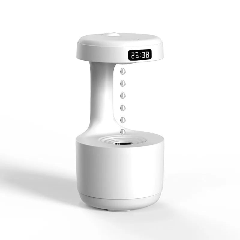 Rose gold and white levitating water drops humidifier with LED light on desk