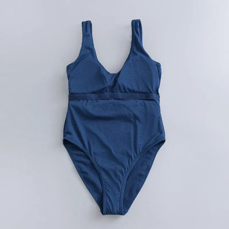 Navy blue solid colour one-piece swimsuit for women with a triangle style and built-in chest pad.