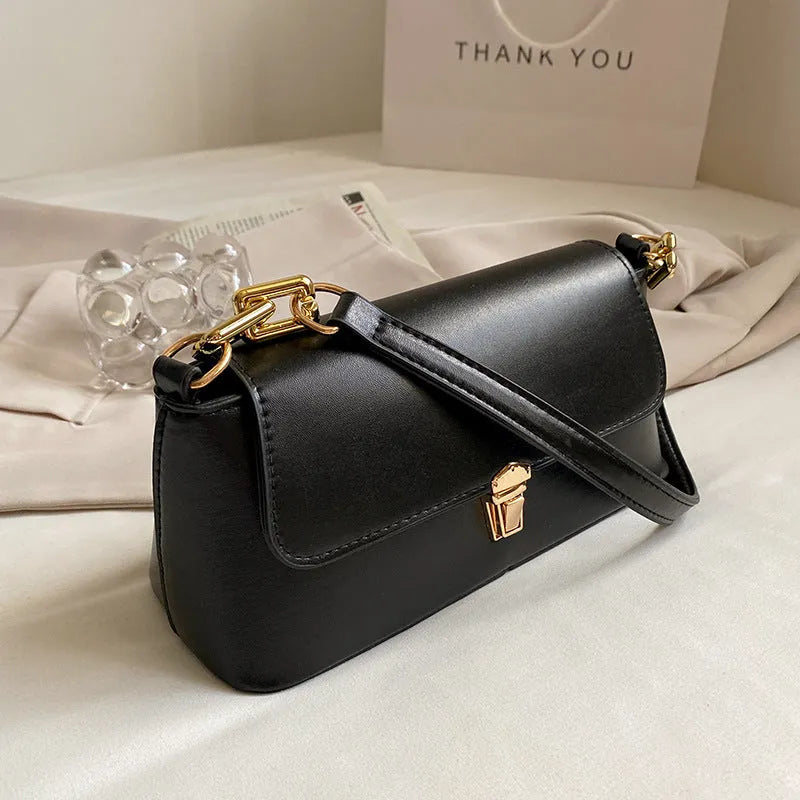 Brown French casual underarm bag with single shoulder chain strap and sandwich pocket design