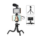 Octopus-style flexible tripod live broadcast kit with fill light and microphone accessories on a table