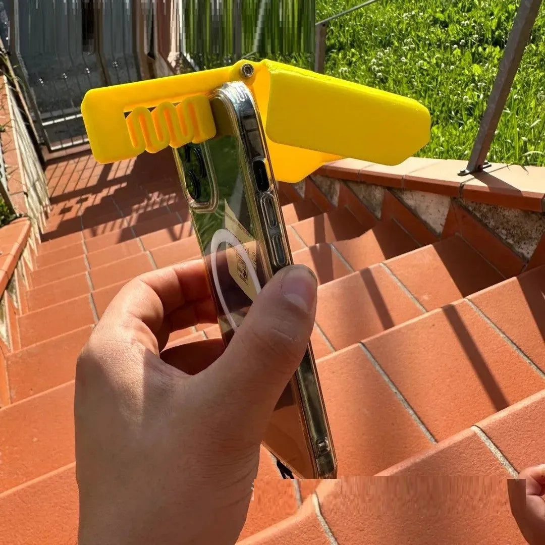 Yellow and black plastic phone clip with an attached sunshade for outdoor screen visibility.