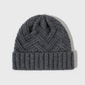 Wool knitted dome crown beanie hat for women in ankela red with a totem pattern.