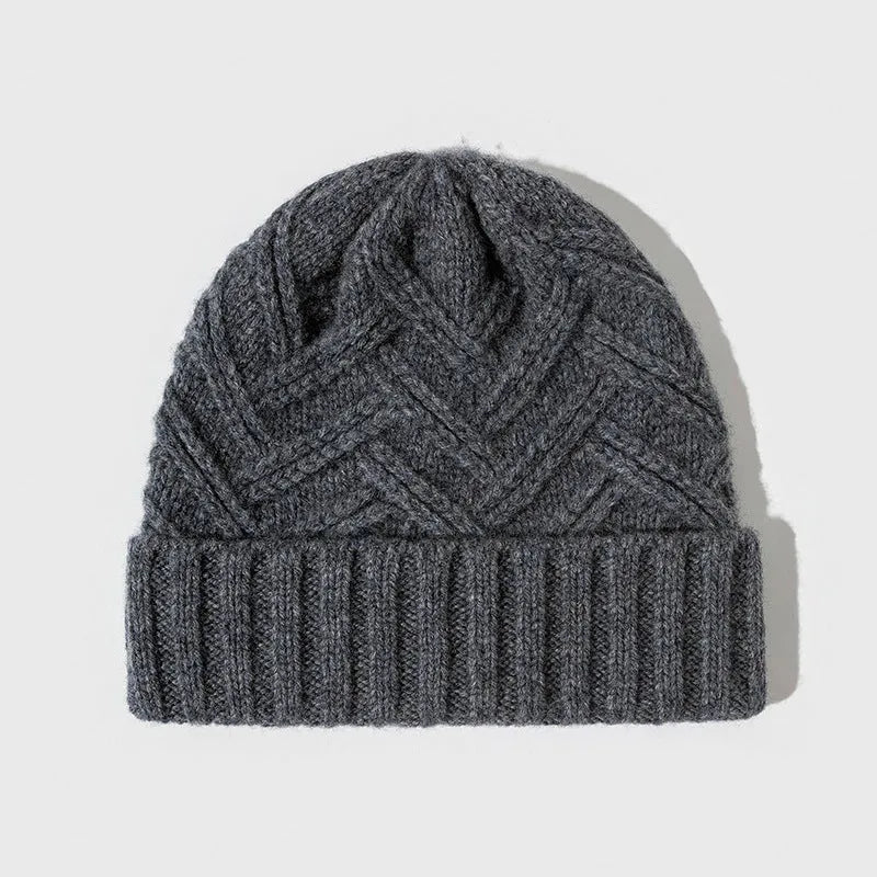 Wool knitted dome crown beanie hat for women in ankela red with a totem pattern.