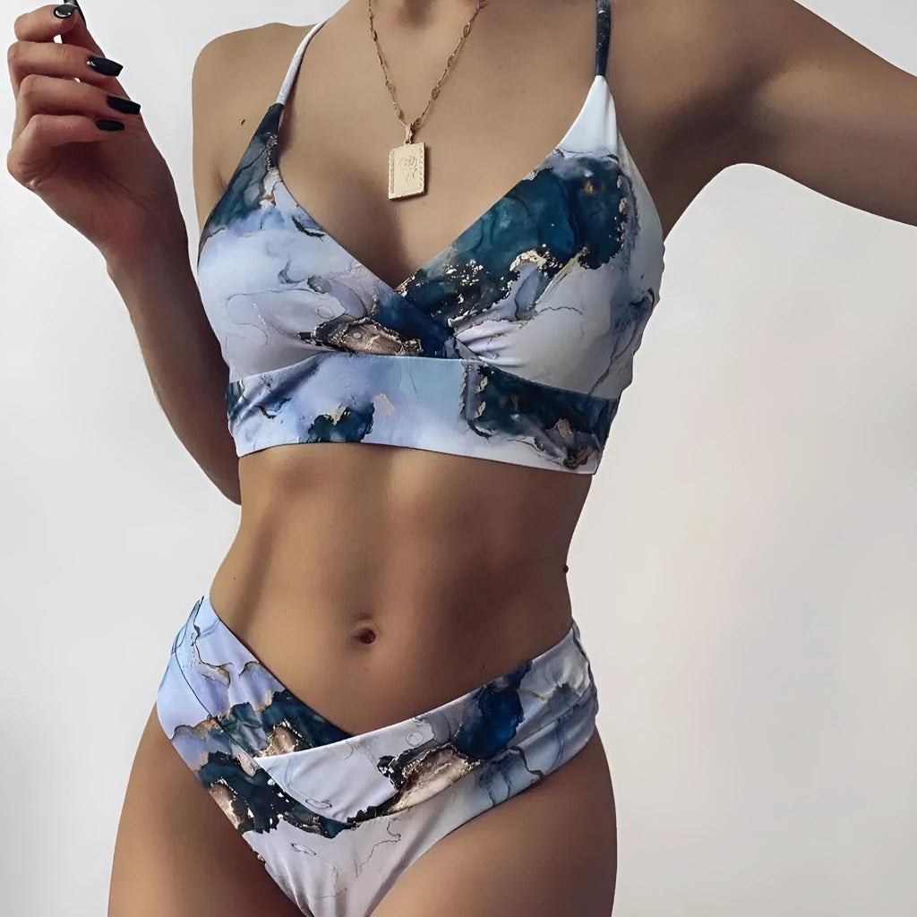 Women's high waist bikini set in a marble tie-dye print, showing U-neck top and briefs.
