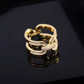 Round copper scarf ring with gold electroplated finish and geometric shape for securing scarves