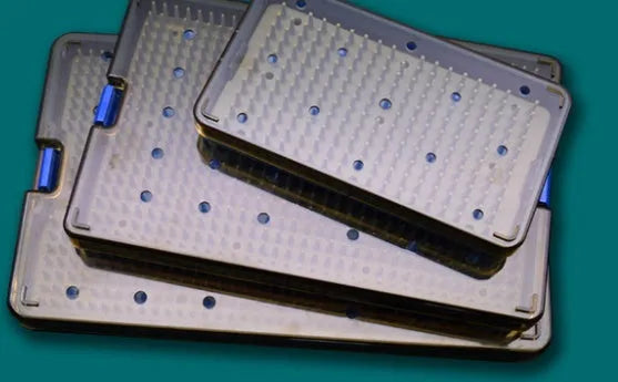 Three silicone disinfection boxes in different sizes with transparent lids.