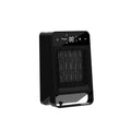 Black desktop electric heater with touch screen display and remote control on a wooden desk.