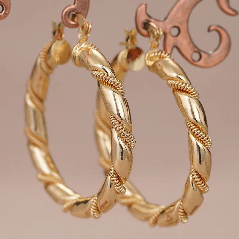 Geometric copper ring ear clip earrings in golden finish with linear design details