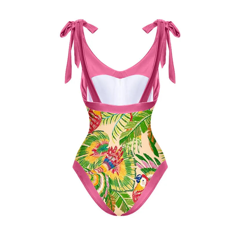 Retro pink floral print one-piece swimsuit with V-neck, skirt, and backless design.