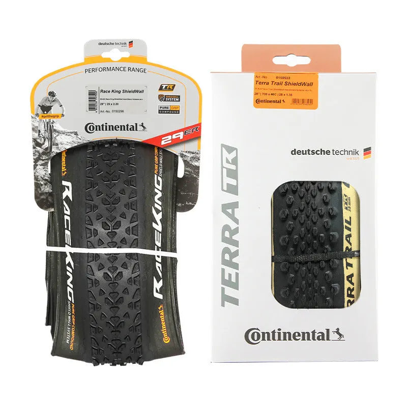 Mountain bike folding tyre with 3-layer construction shown in yellow or white sidewall options