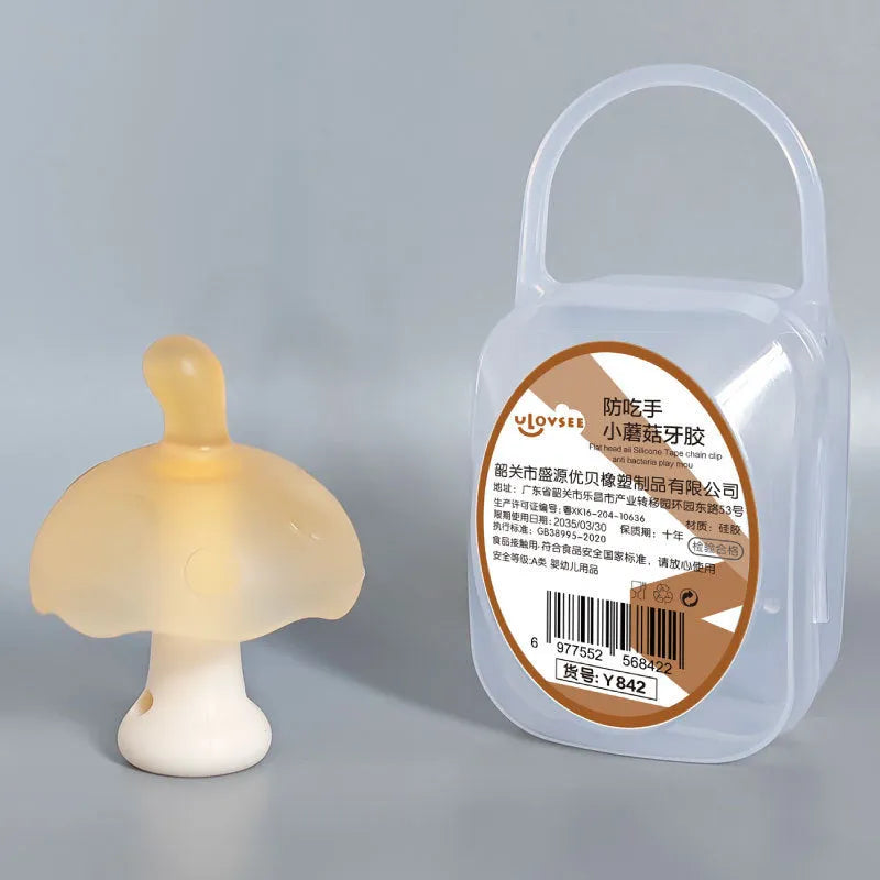 Small pink and nano coloured mushroom-shaped chewable silicone jewellery with a transparent chain and box.