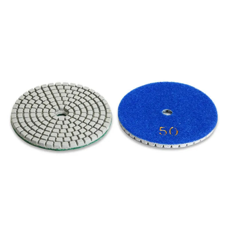 Set of 10 emery stone polishing discs with grits from 50 to 3000 mesh on a grey background.