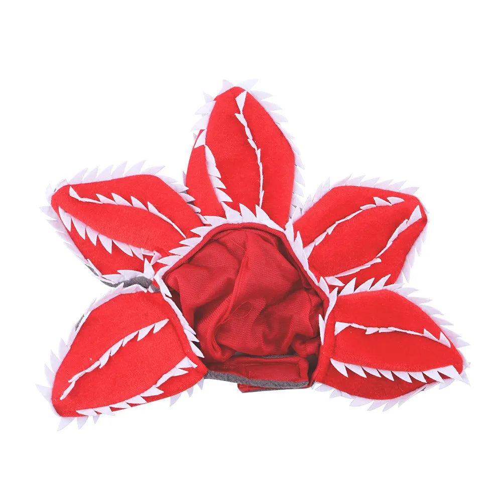 Medium dog wearing Halloween demon chomper costume with scary flower headband