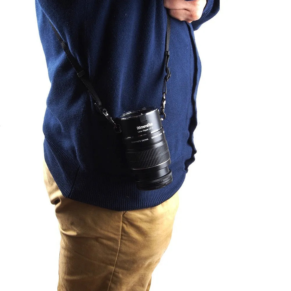Aluminium alloy camera lens flipper holder for Nikon E-Mount with stainless steel buckle and cotton strap.
