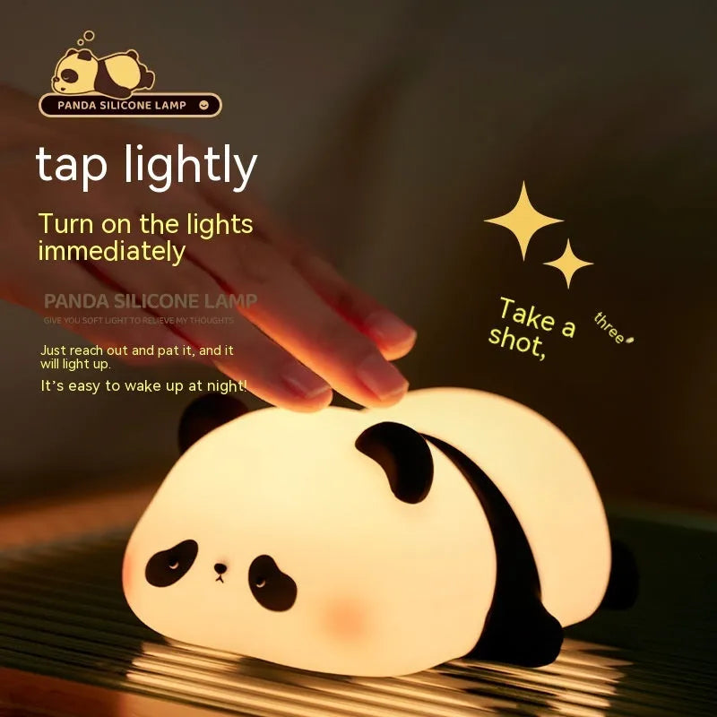 Cartoon panda-shaped silicone night light for children on a table.